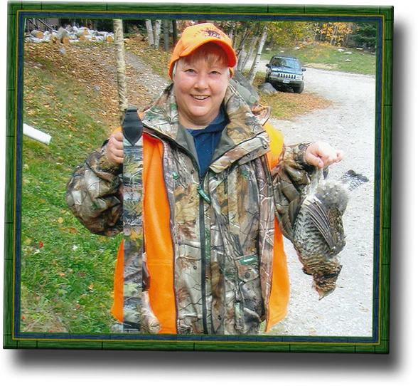 Hunter with grouse at Green Wilderness Lodge